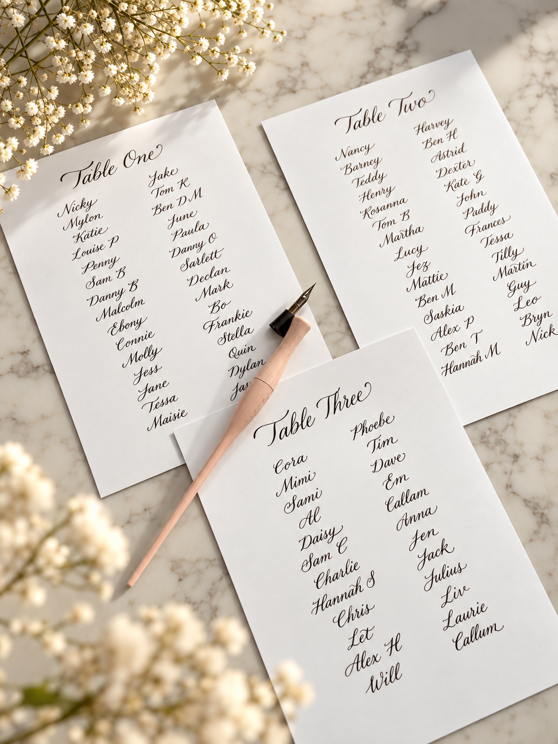 Handwritten table plan lists arranged on marble