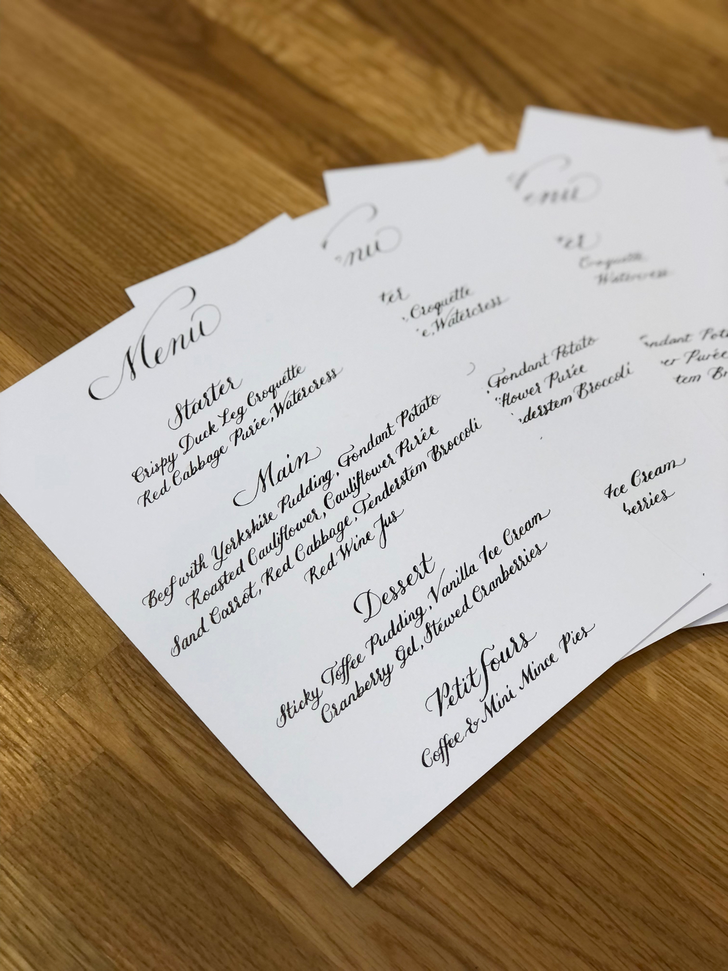 Handwritten menu on white card