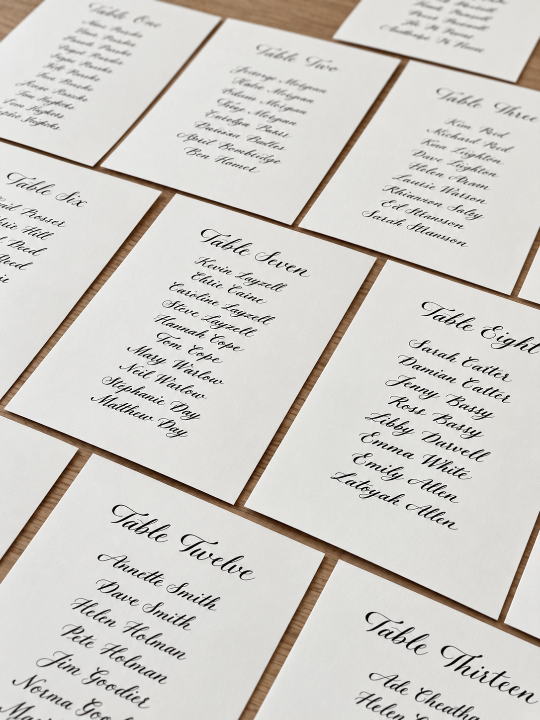 Hand-lettered wedding table plan cards